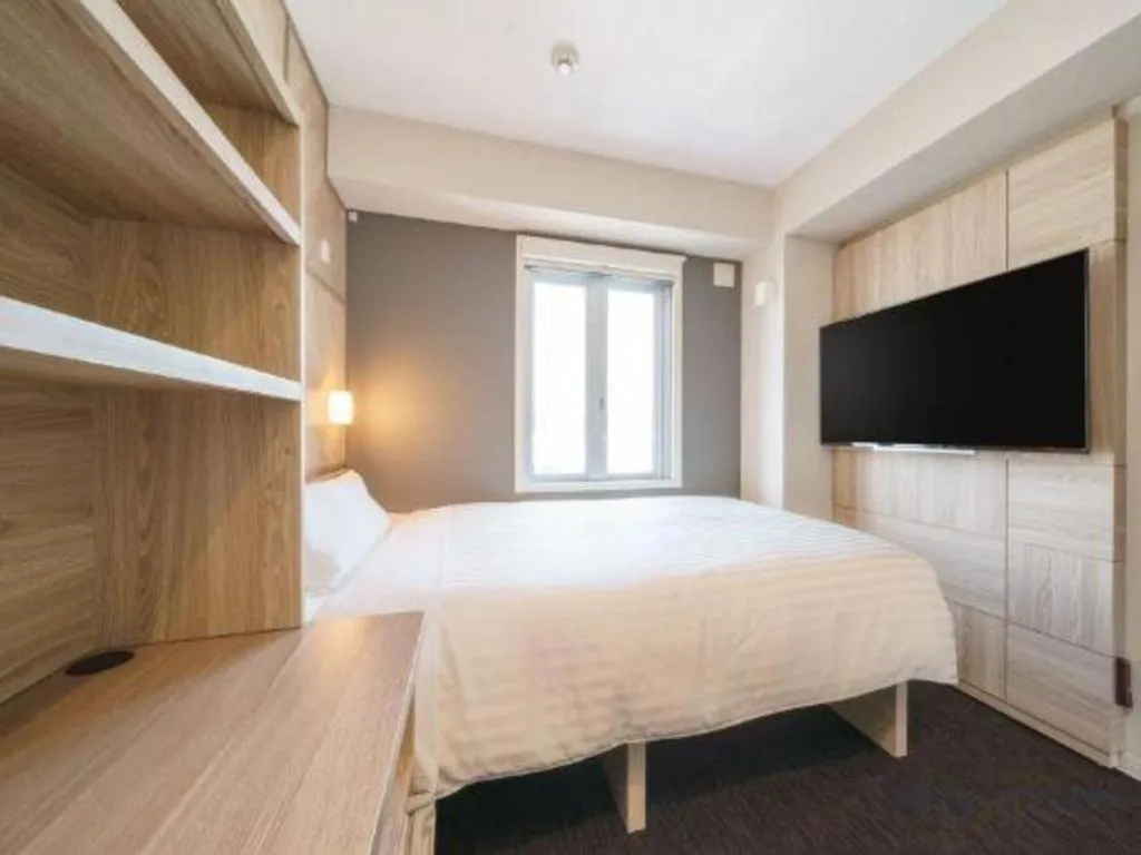 Bed in Super Hotel Satsuma Sendai