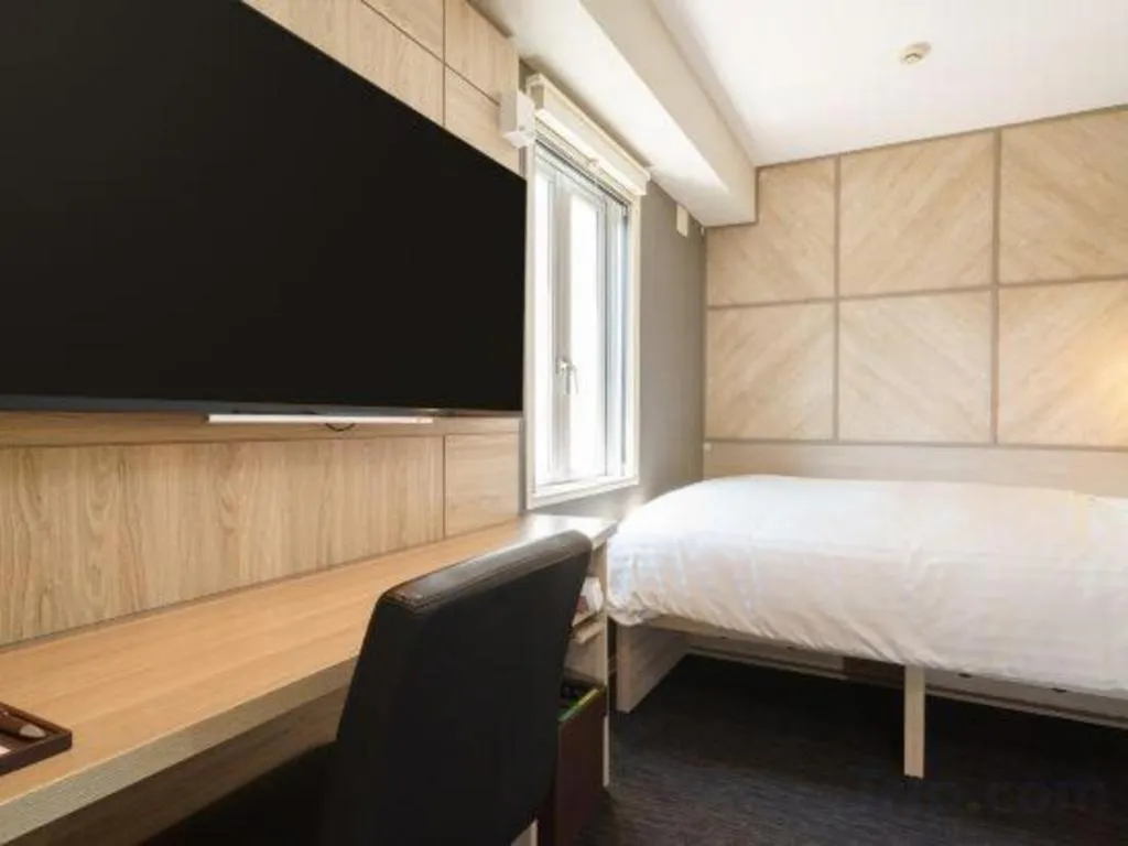 Bed in Super Hotel Satsuma Sendai