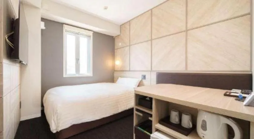 Bed in Super Hotel Satsuma Sendai