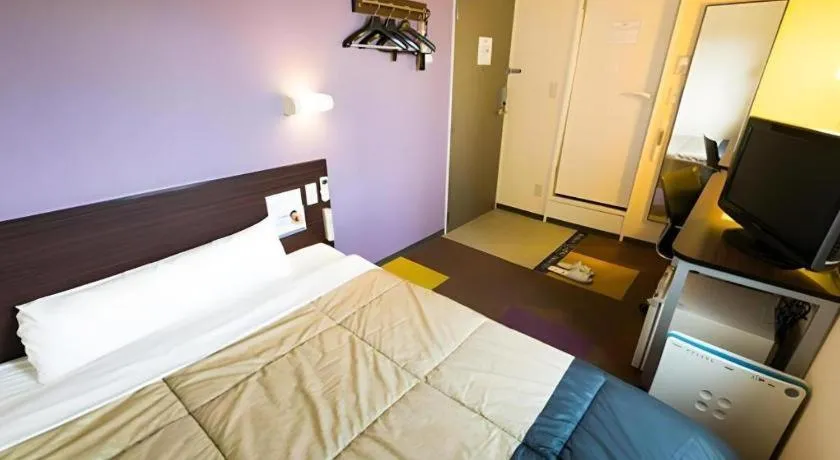 Bed in Super Hotel Satsuma Sendai