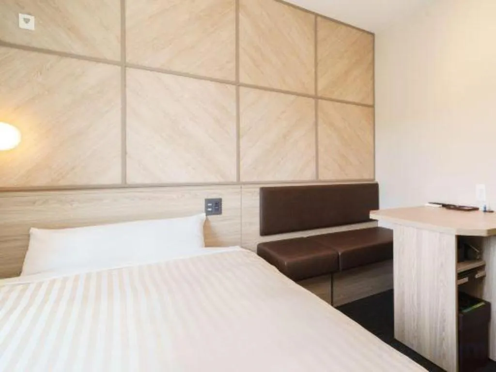 Bed in Super Hotel Satsuma Sendai