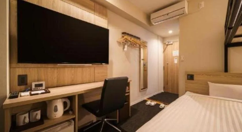 Bed in Super Hotel Satsuma Sendai