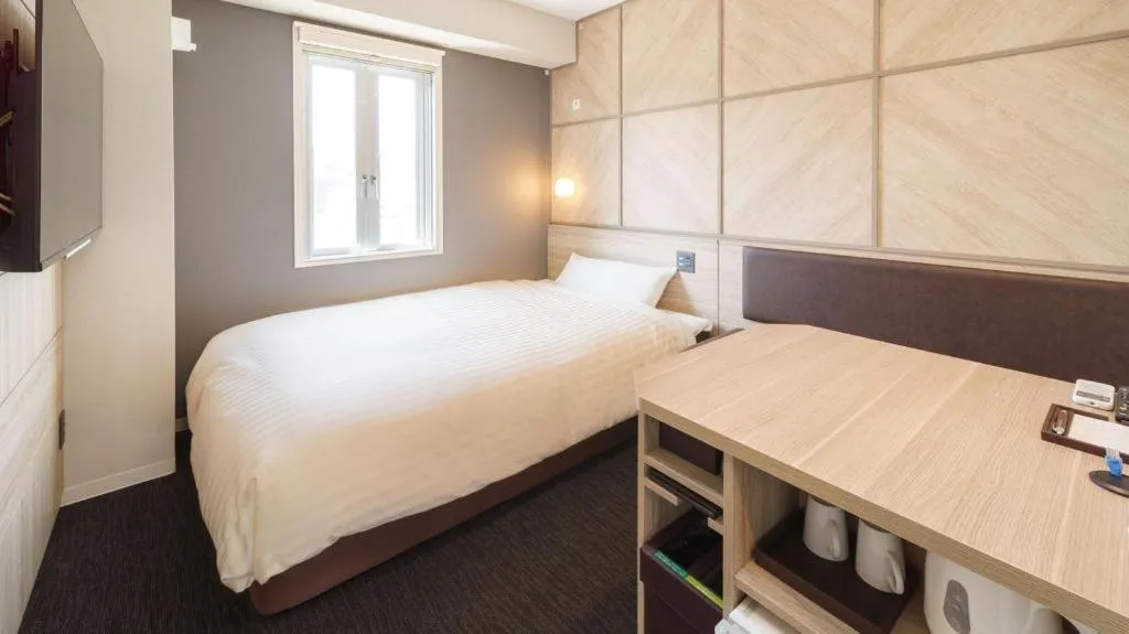 Bed in Super Hotel Satsuma Sendai