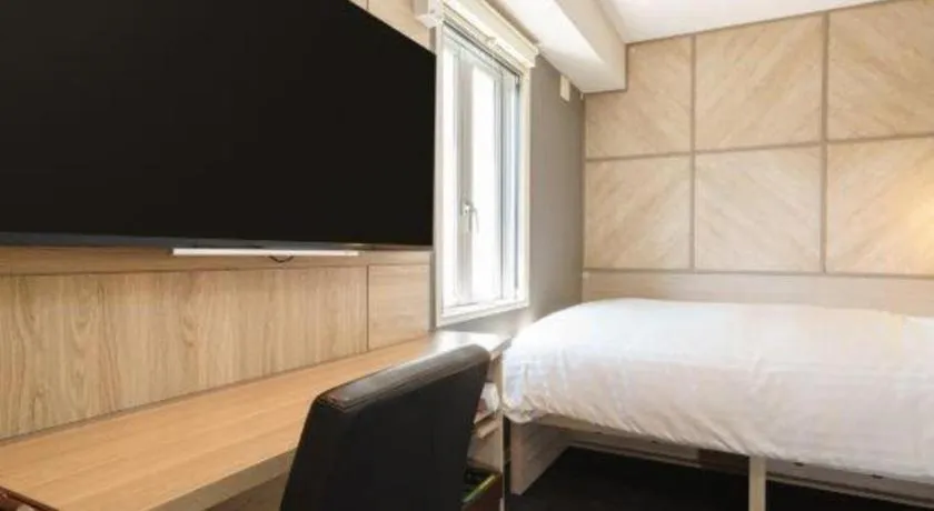 Bed in Super Hotel Satsuma Sendai