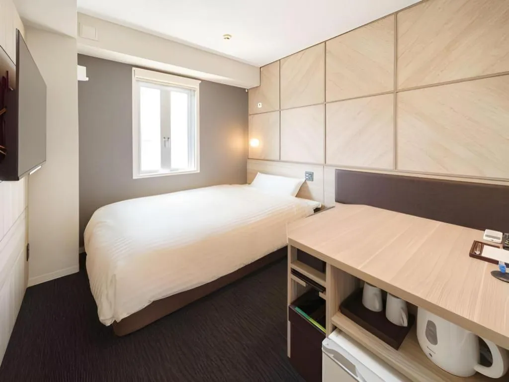 Bed in Super Hotel Satsuma Sendai