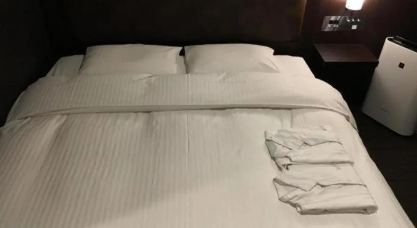 Bed in Belken Hotel Tokyo