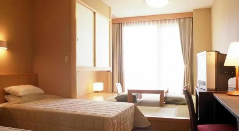 Bed in Sea Side Villa Bokkai