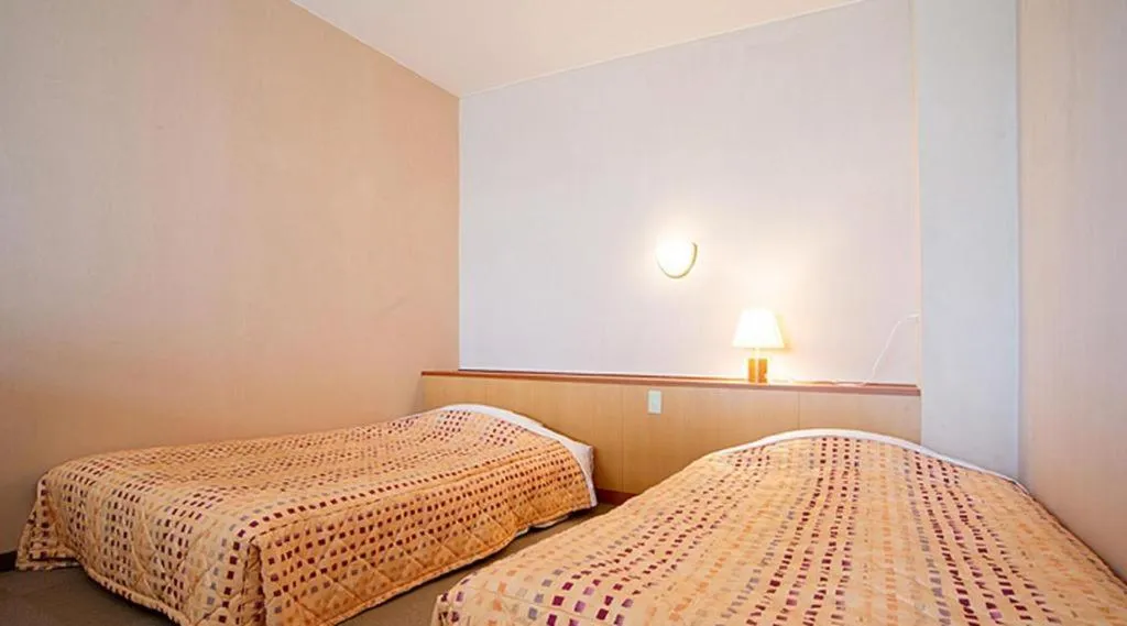 Bed in Sea Side Villa Bokkai