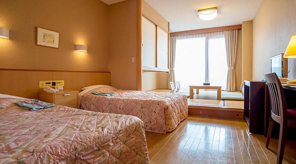 Bed in Sea Side Villa Bokkai