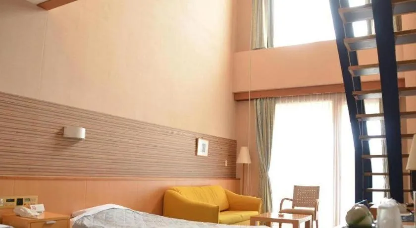 Bed in Sea Side Villa Bokkai