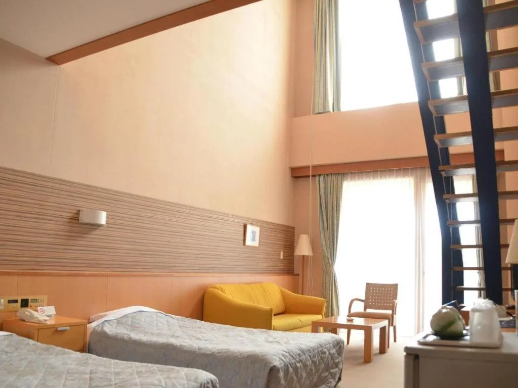 Bed in Sea Side Villa Bokkai