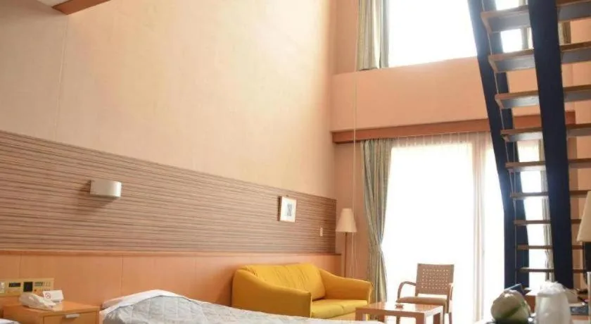 Bed in Sea Side Villa Bokkai