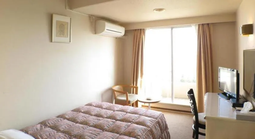 Bed in Hotel Tenchikaku