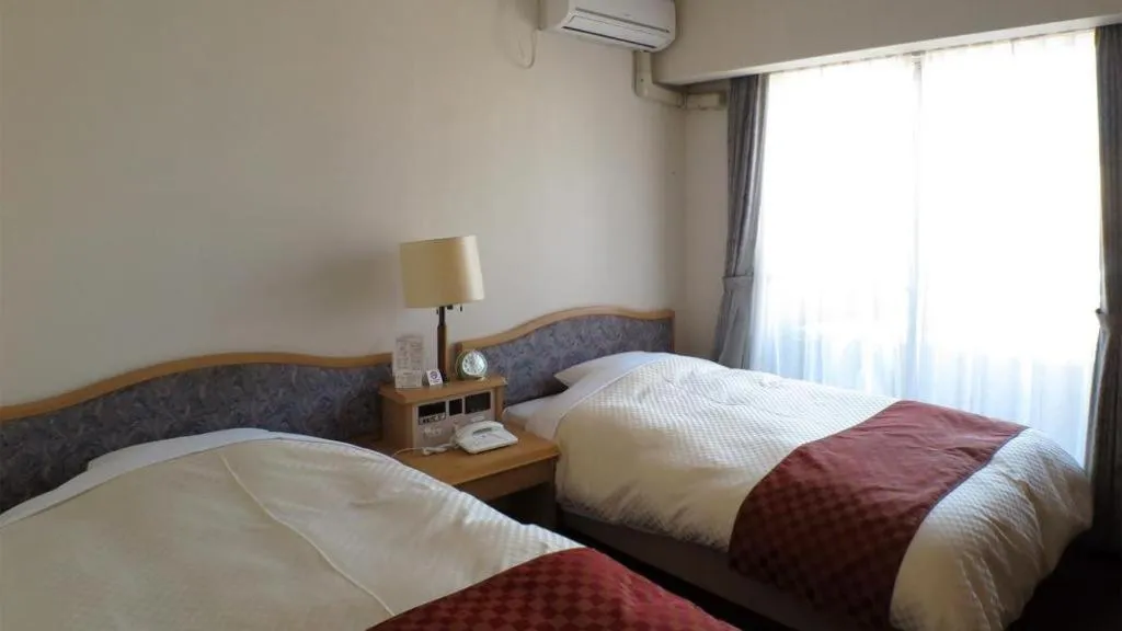 Bed in Hotel Tenchikaku