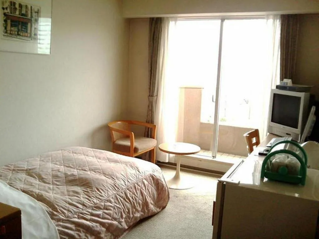 Bed in Hotel Tenchikaku