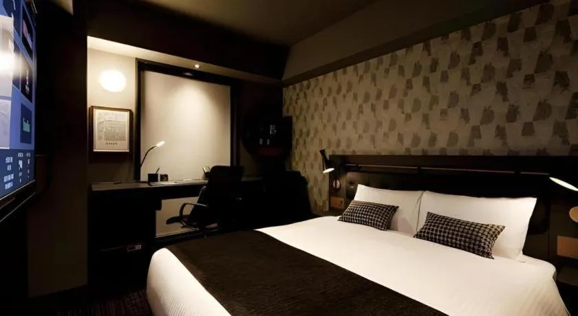 Bed in Daiwa Roynet Hotel OSAKA-SHIN UMEDA ANNEX