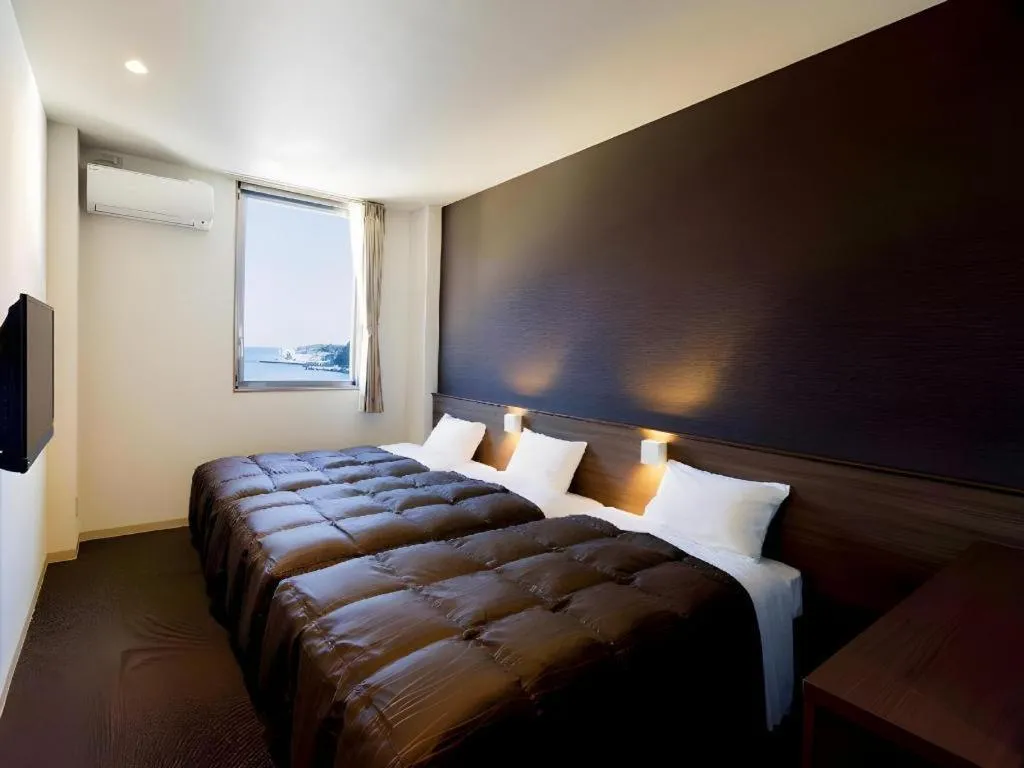 Bed in Daemado Hotel Hitakatsu