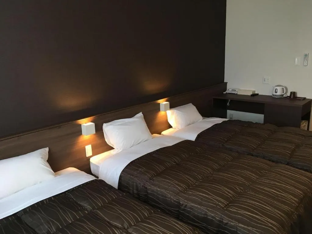 Bed in Daemado Hotel Hitakatsu