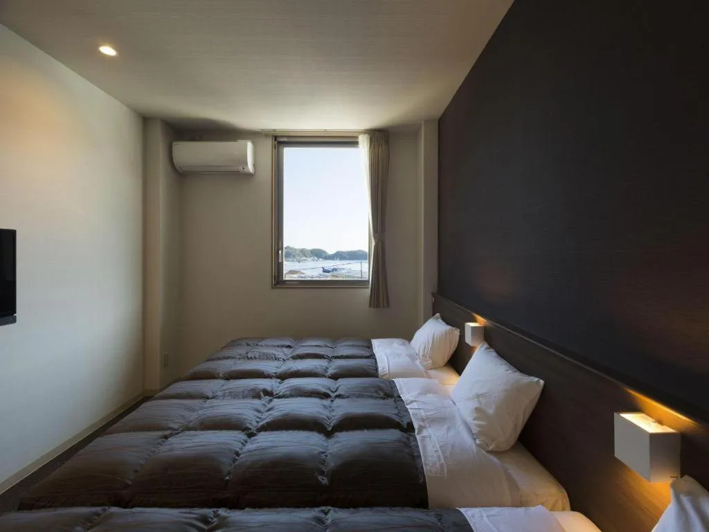 Bed in Daemado Hotel Hitakatsu