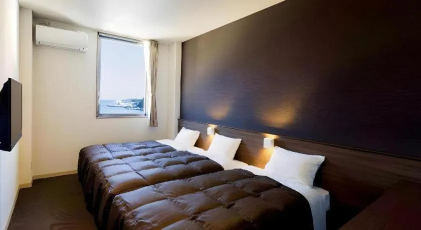 Bed in Daemado Hotel Hitakatsu