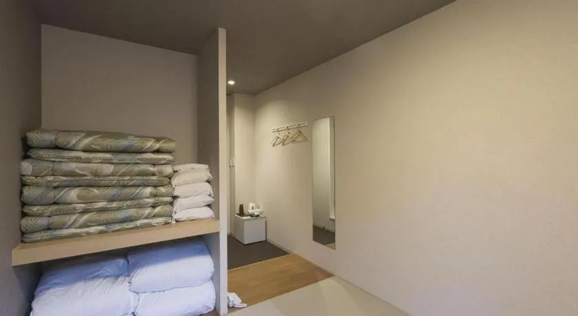 Bed in Daemado Hotel Hitakatsu