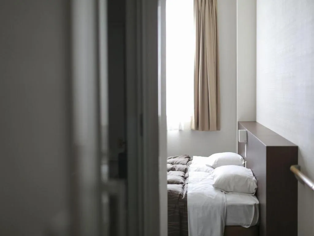 Bed in Daemado Hotel Hitakatsu