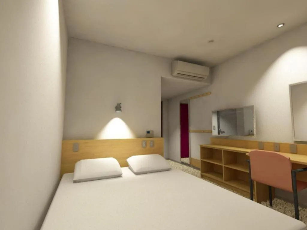 Bed in AKISAWA HOTEL