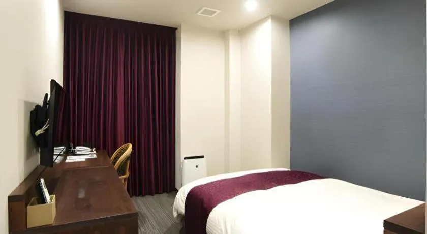 Bed in AKISAWA HOTEL