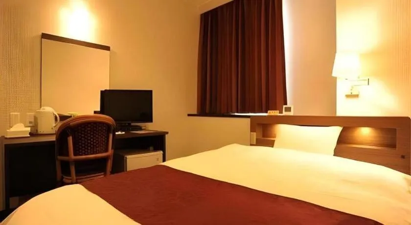 Bed in AKISAWA HOTEL