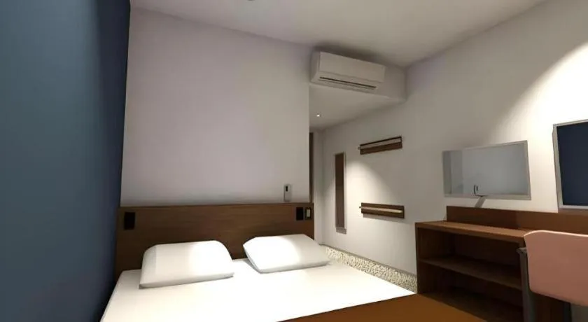 Bed in AKISAWA HOTEL