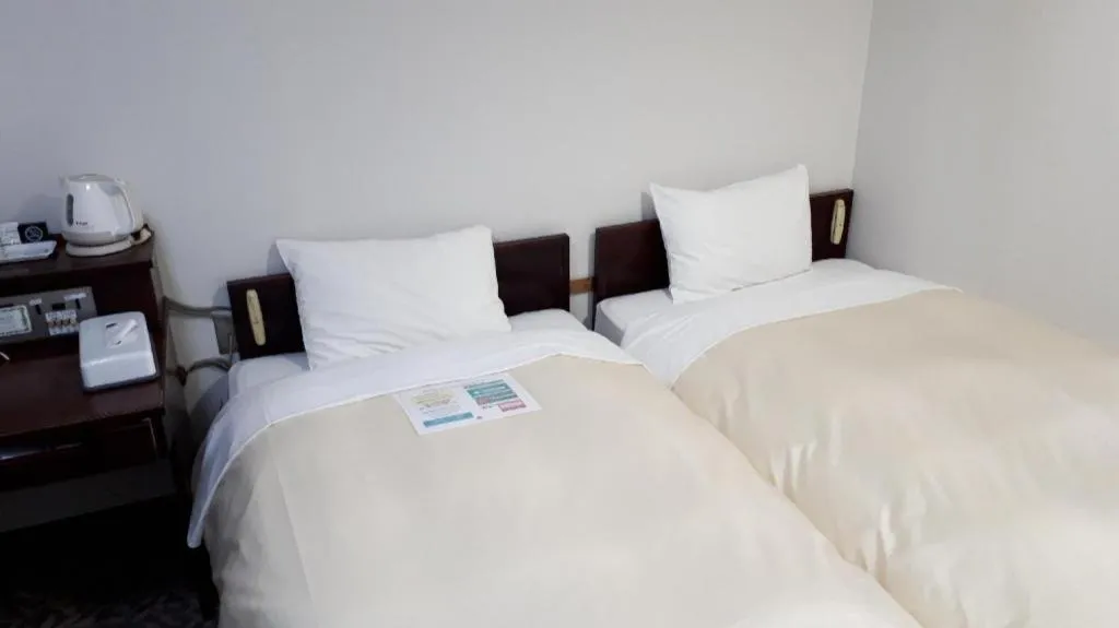 Bed in Hotel Sunshine Iwaki
