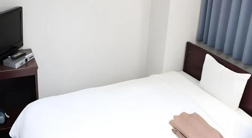 Bed in Hotel Sunshine Iwaki