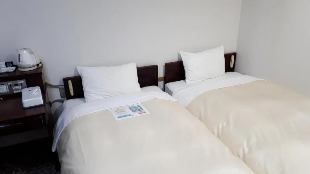 Bed in Hotel Sunshine Iwaki
