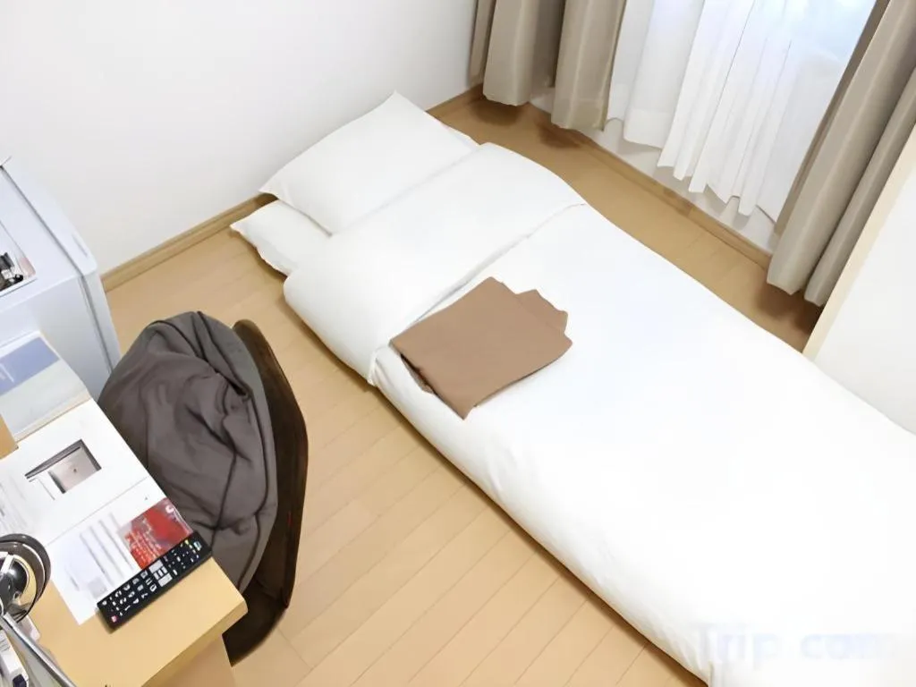 Bed in Hotel Sunshine Iwaki