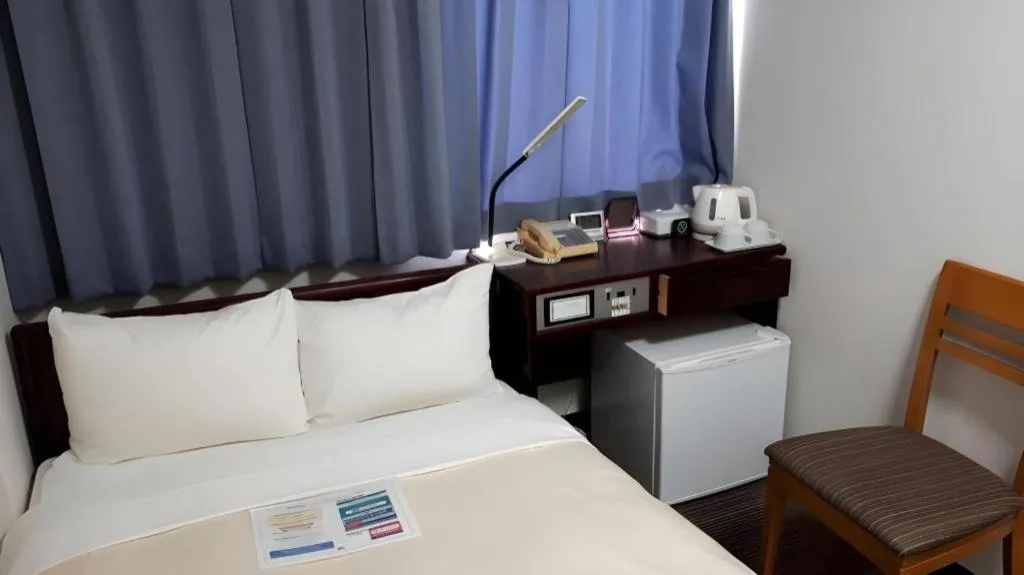 Bed in Hotel Sunshine Iwaki