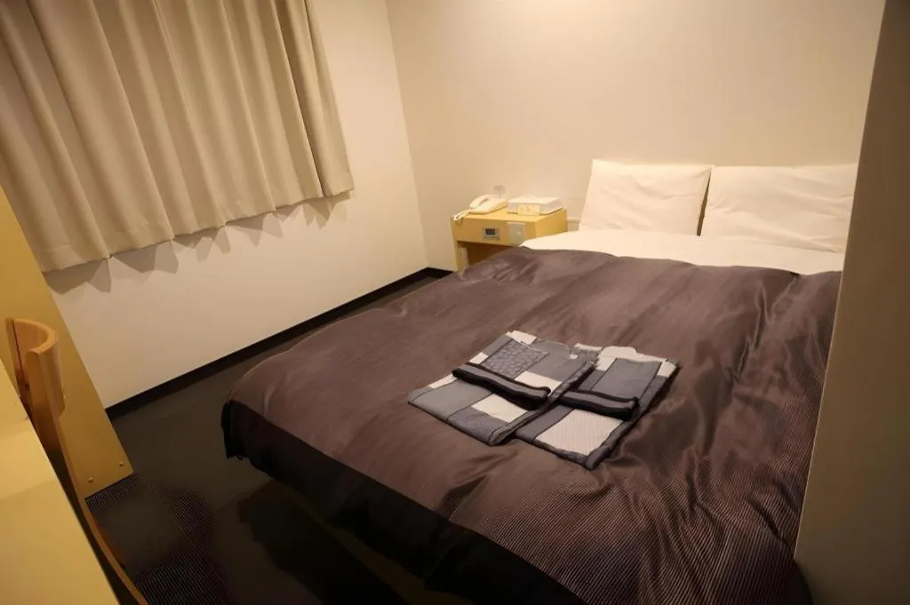 Bed in Hotel Sunshine Iwaki