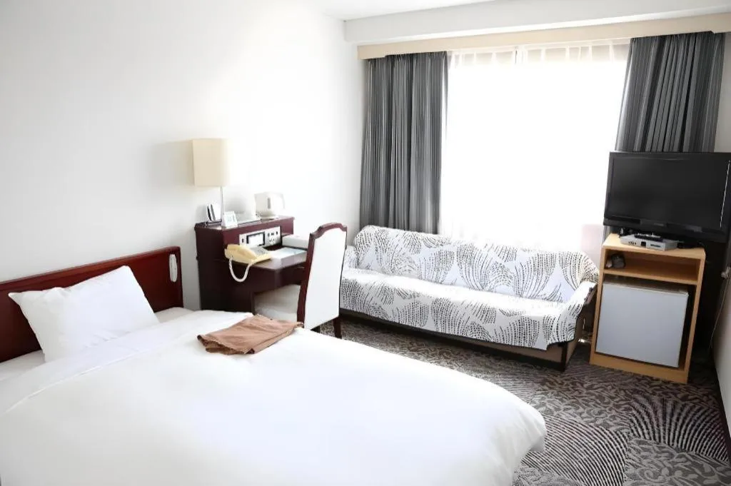 Bed in Hotel Sunshine Iwaki