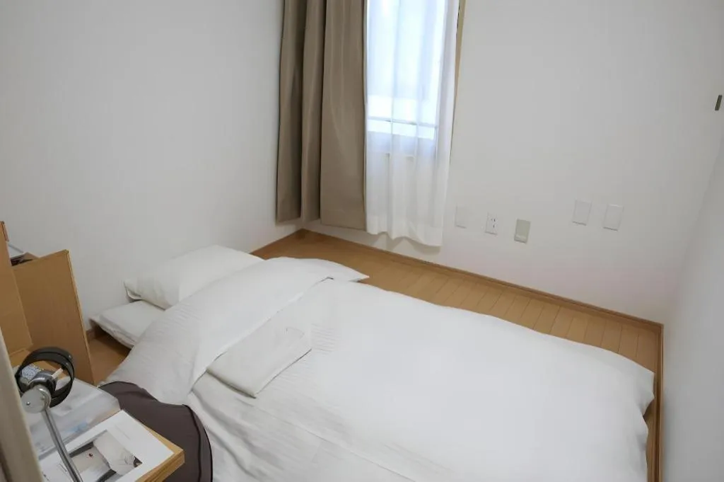 Bed in Hotel Sunshine Iwaki