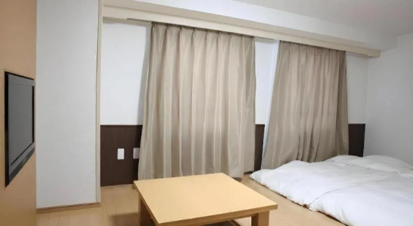 Bed in Hotel Sunshine Iwaki