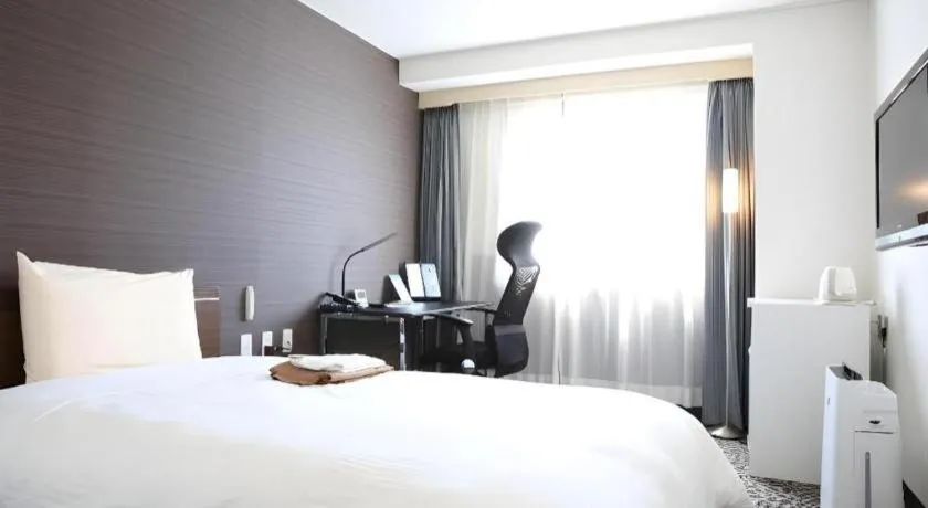 Bed in Hotel Sunshine Iwaki