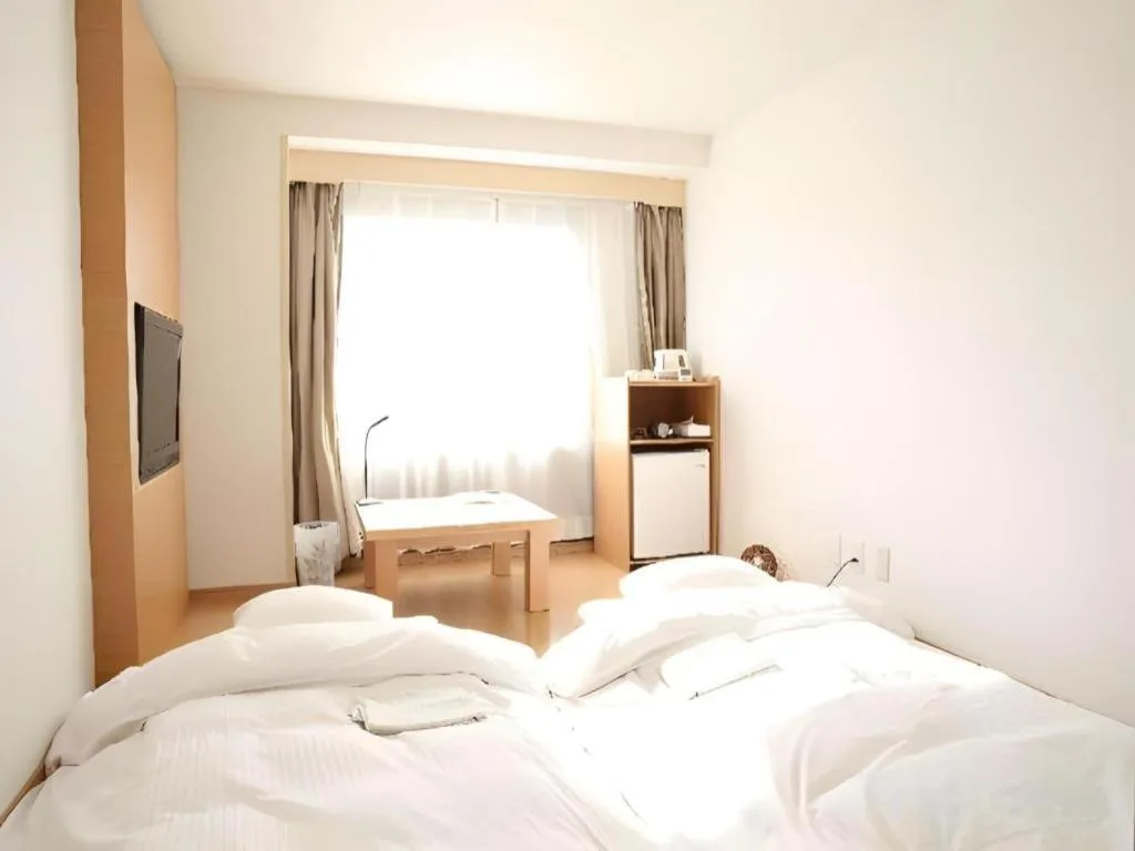 Bed in Hotel Sunshine Iwaki