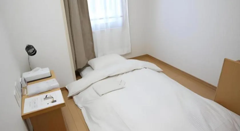 Bed in Hotel Sunshine Iwaki