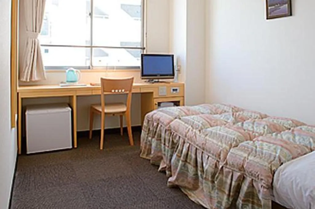 Bed in Hotel Sunshine Iwaki