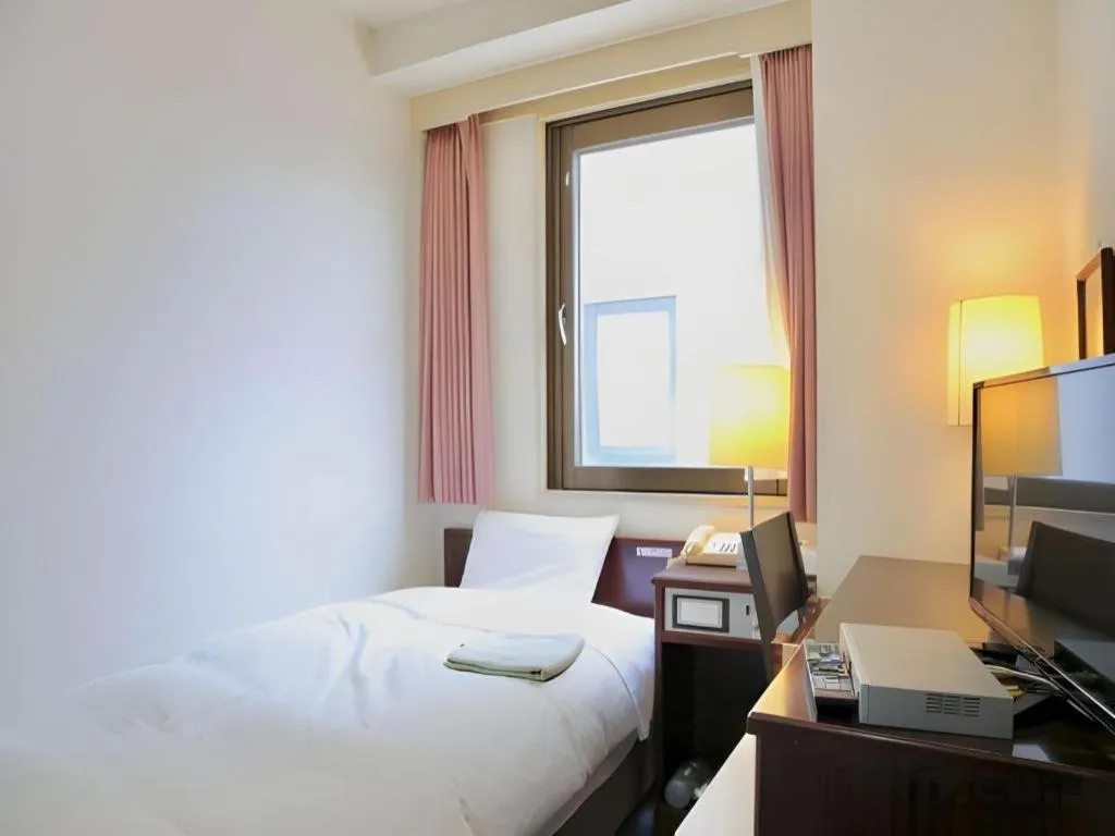 Bed in Hotel Sunshine Iwaki