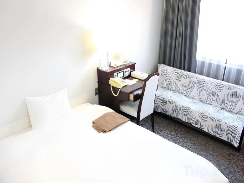 Bed in Hotel Sunshine Iwaki