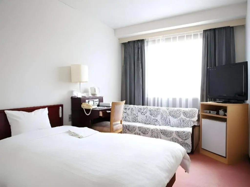 Bed in Hotel Sunshine Iwaki