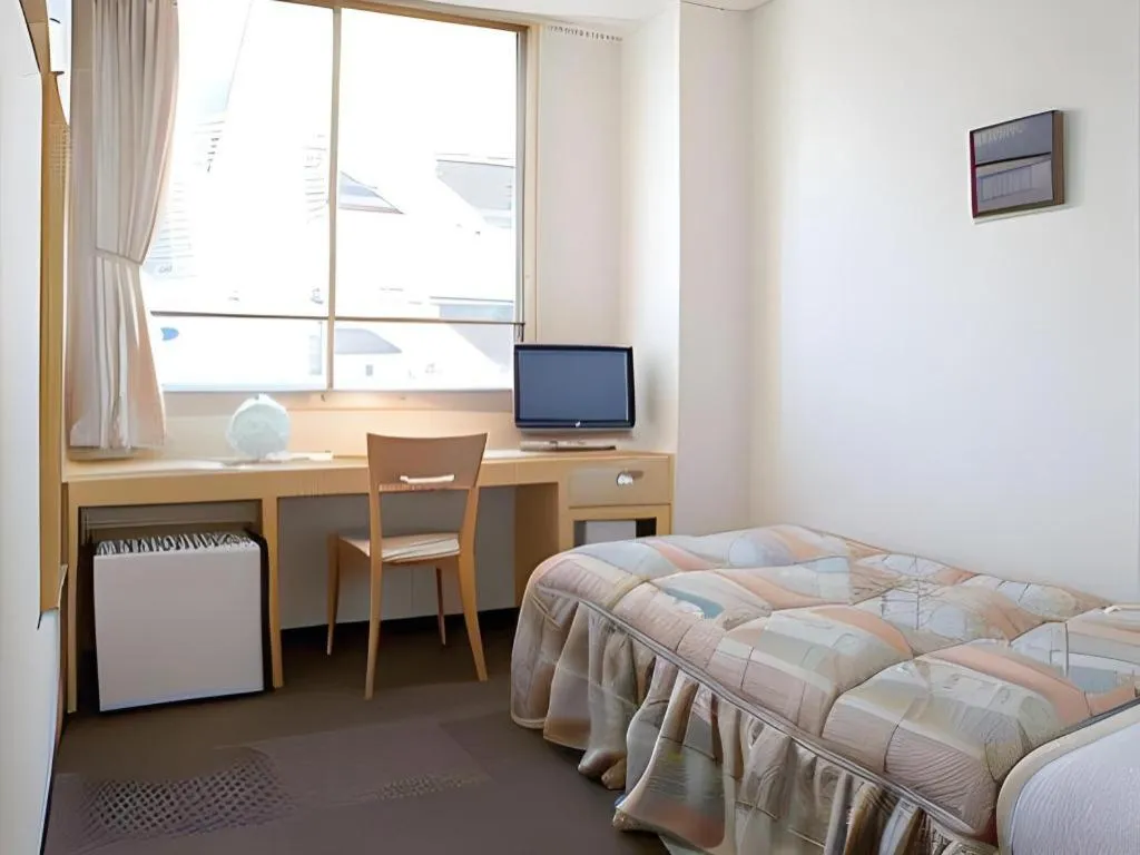 Bed in Hotel Sunshine Iwaki