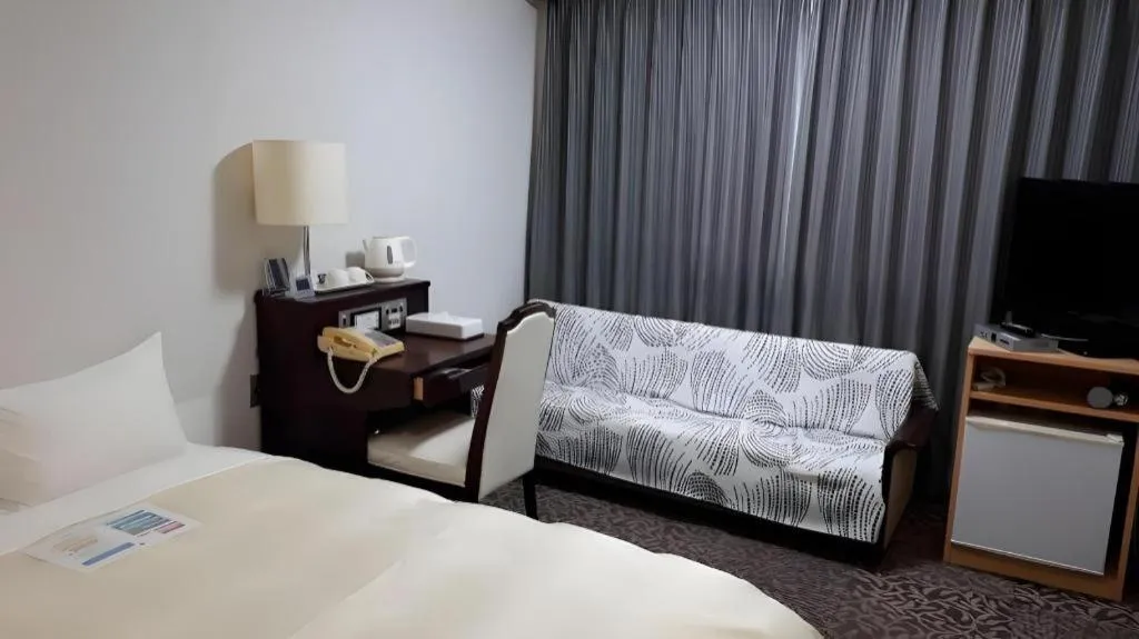 Bed in Hotel Sunshine Iwaki