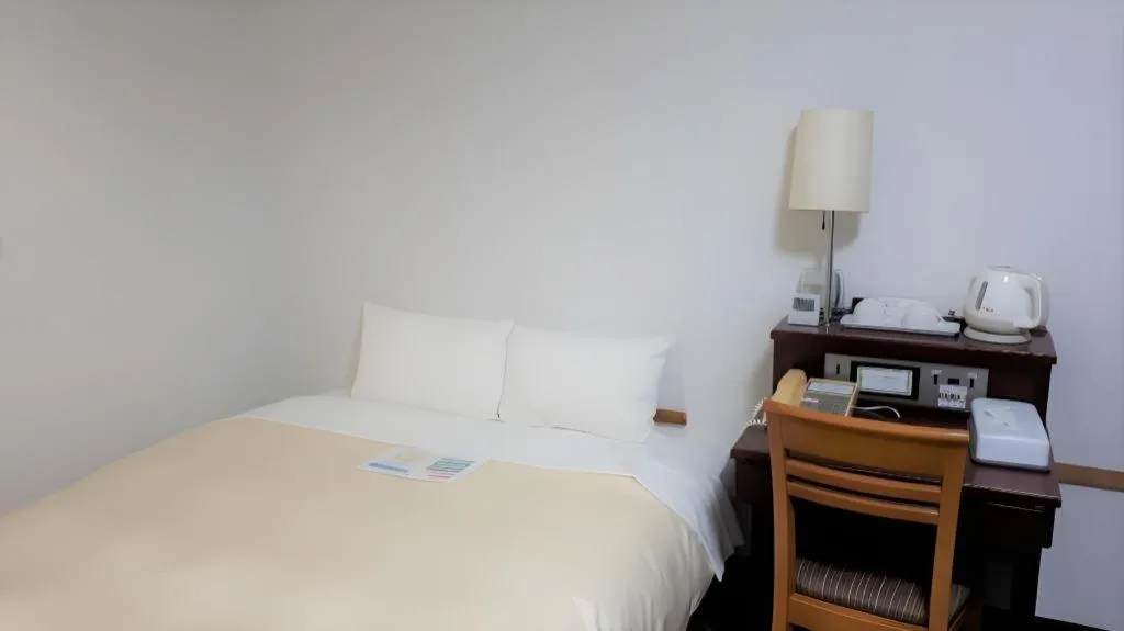 Bed in Hotel Sunshine Iwaki