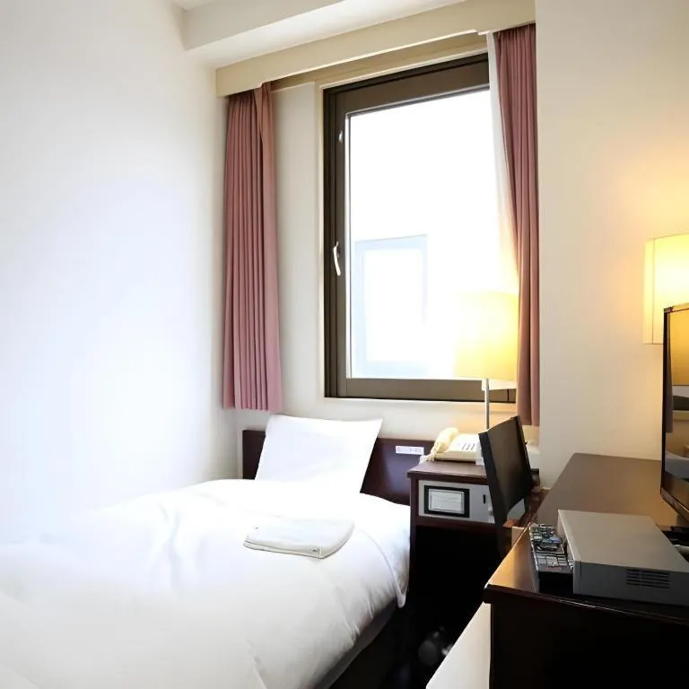 Bed in Hotel Sunshine Iwaki